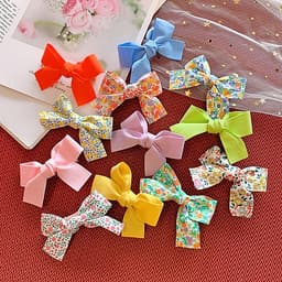 Kẹp tóc cho bé gái set 2 chiếc đính nơ rất dễ thương PK36