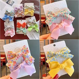 Kẹp tóc cho bé gái set 2 chiếc đính nơ rất dễ thương PK36