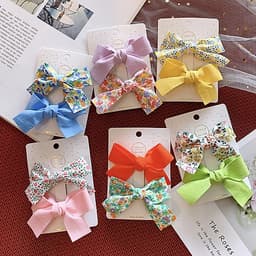 Kẹp tóc cho bé gái set 2 chiếc đính nơ rất dễ thương PK36
