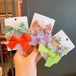 Kẹp tóc cho bé gái set 2 chiếc đính nơ rất dễ thương PK36