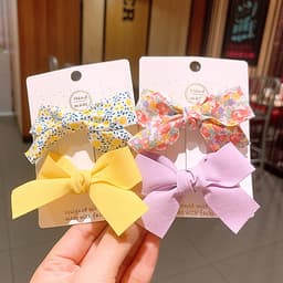 Kẹp tóc cho bé gái set 2 chiếc đính nơ rất dễ thương PK36