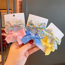 Kẹp tóc cho bé gái set 2 chiếc đính nơ rất dễ thương PK36